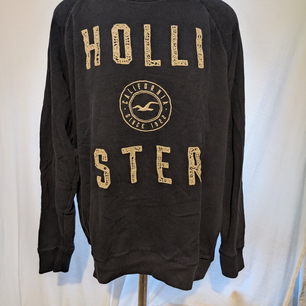 Hollister Black Sweater with Tan Graphic